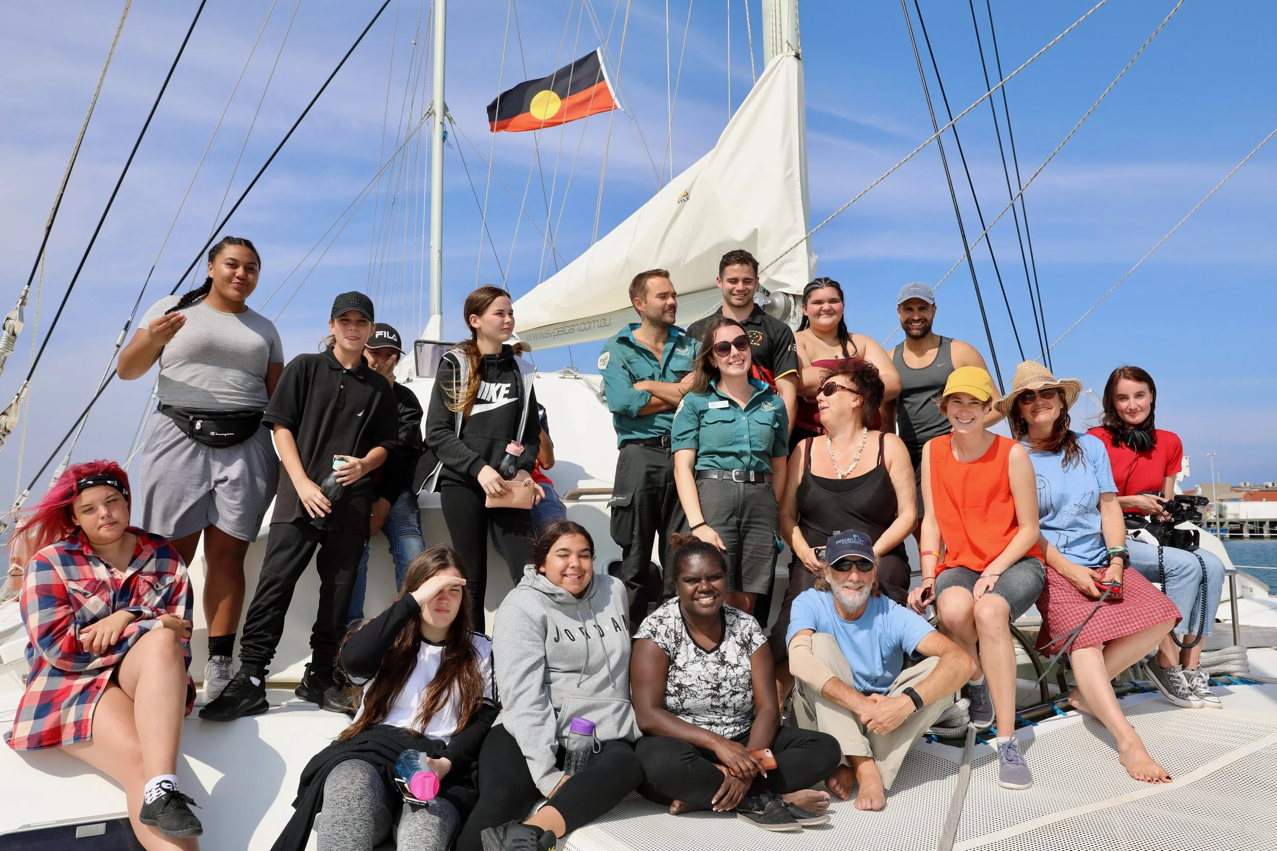 Aboriginal flag flying above Pelican 1 — Sea Country voyage